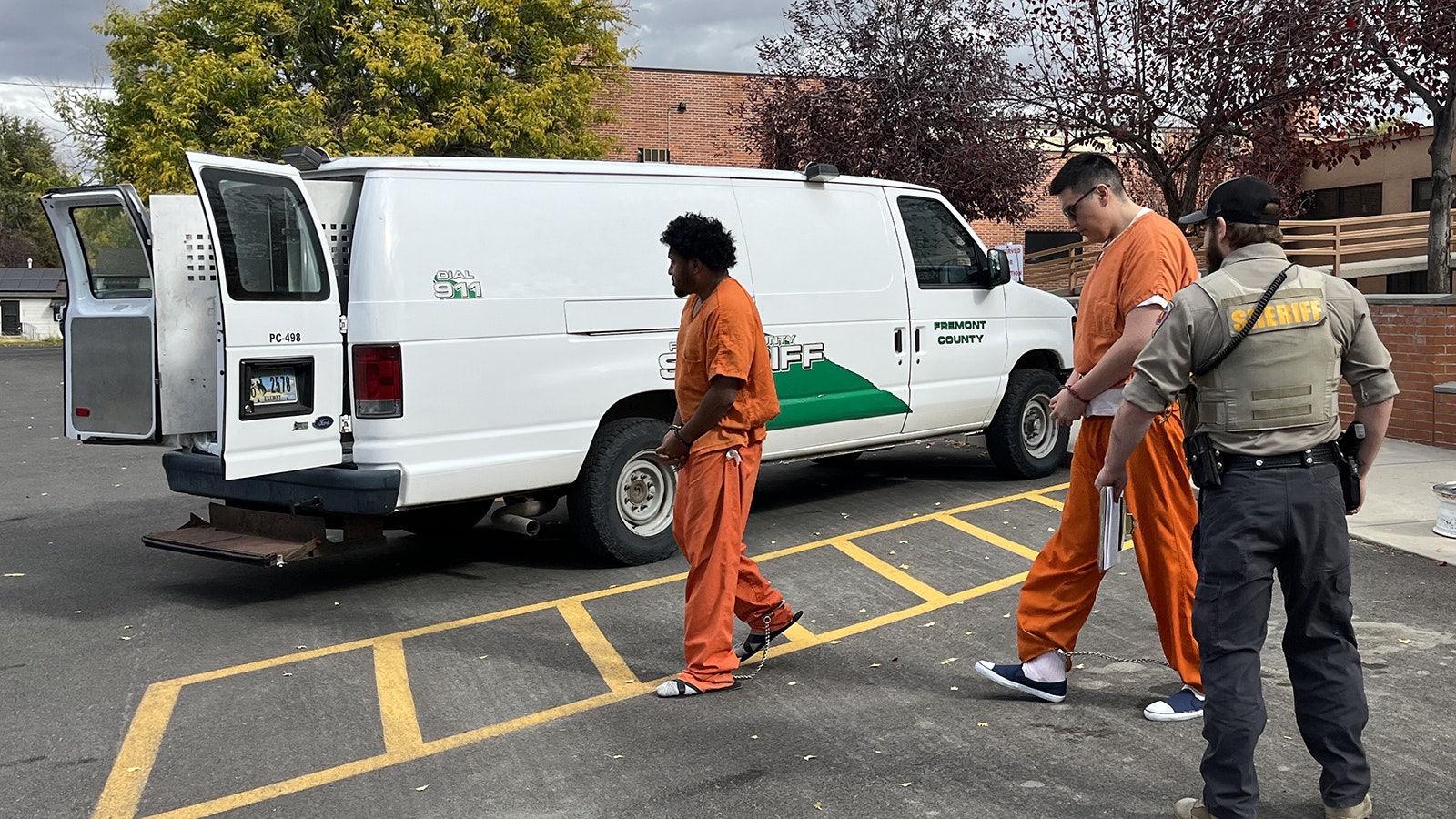 Nicholas Blackburn, center, surrendered to the Fremont County Jail transport van Thursday after pleading not guilty to his friend's murder.