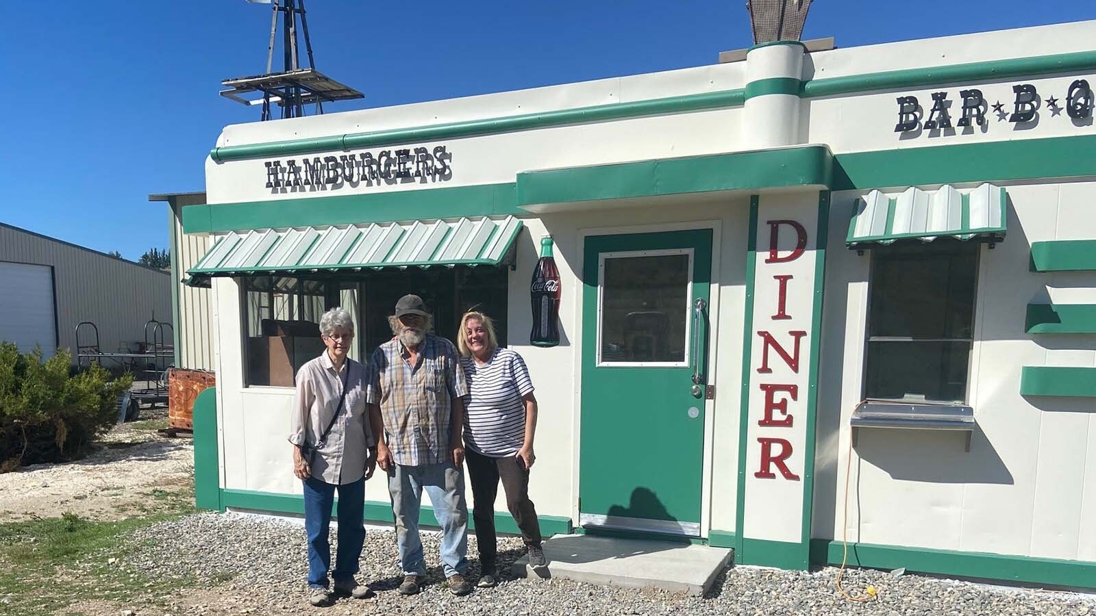 Marsha Harris, from left, Ken Quintilliani and Robyn Cutter pose in fron tof the Nifty Niner Diner.