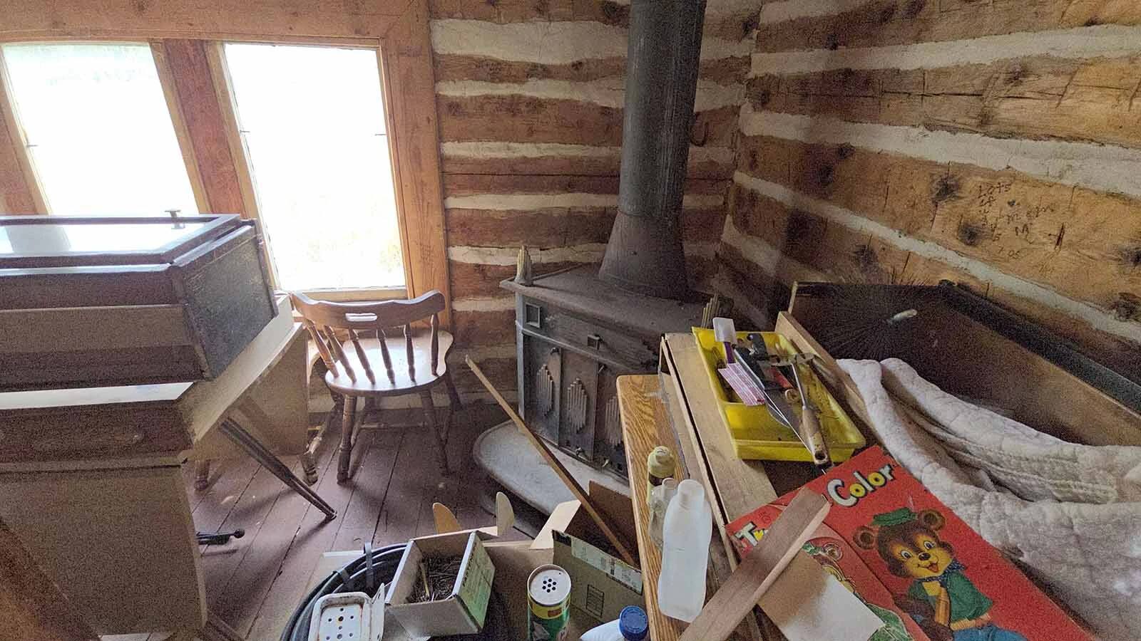 A wood stove in the corner was used to help heat the Niland cabin in the Medcine Bow-Routt National Forest.