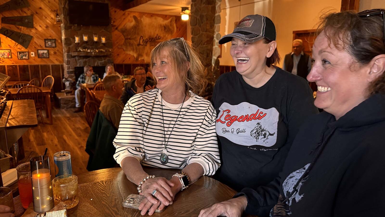 Twila Barnett, from left, Eva Tackett and Shawna Glendy at Legends Bar & Grill in Lusk laugh out loud when asked how a No Kings protest would go over in their town.