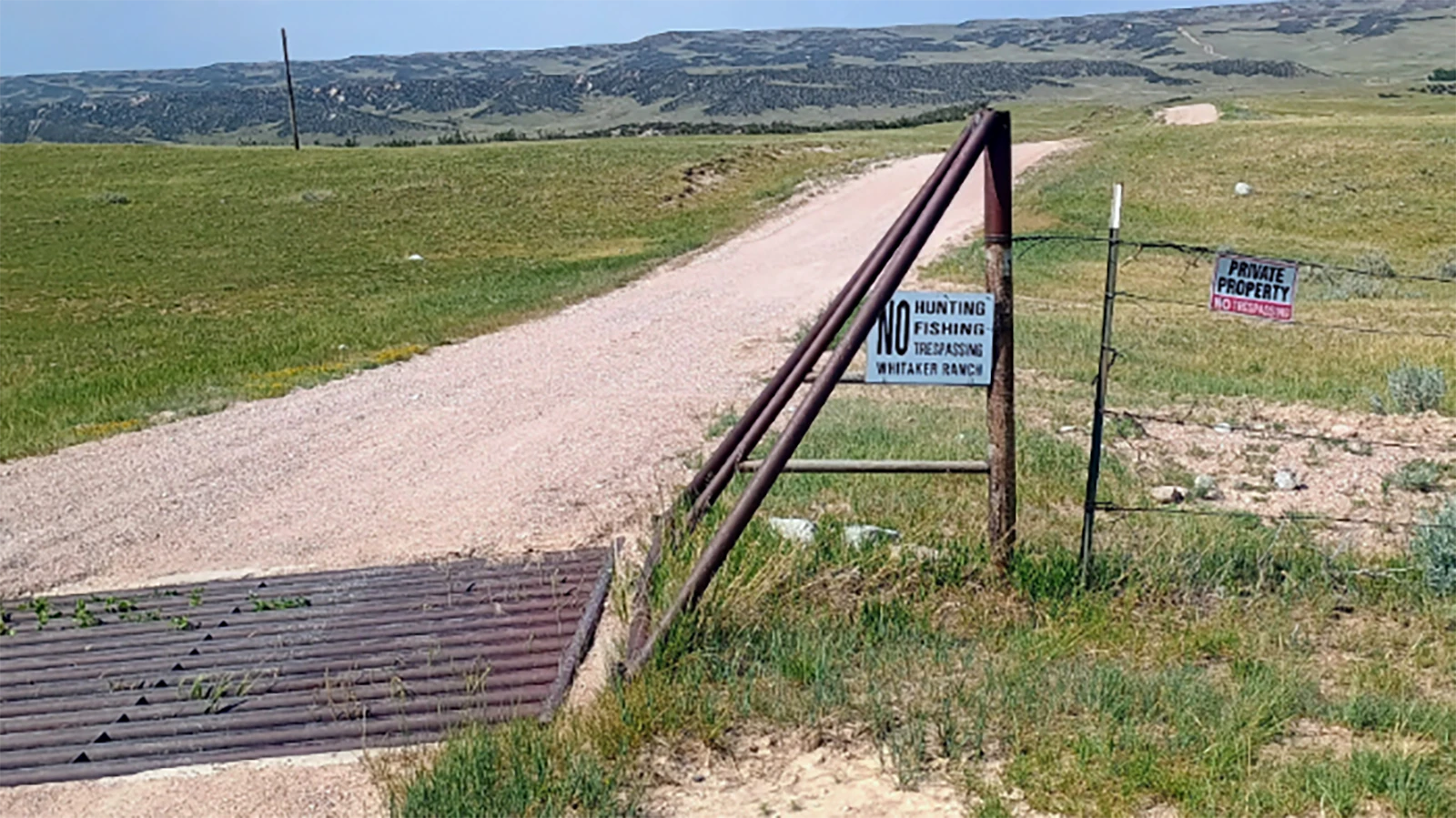 A sign on the Whitaker Ranch reads, "No hunting, fishing, trespassing."