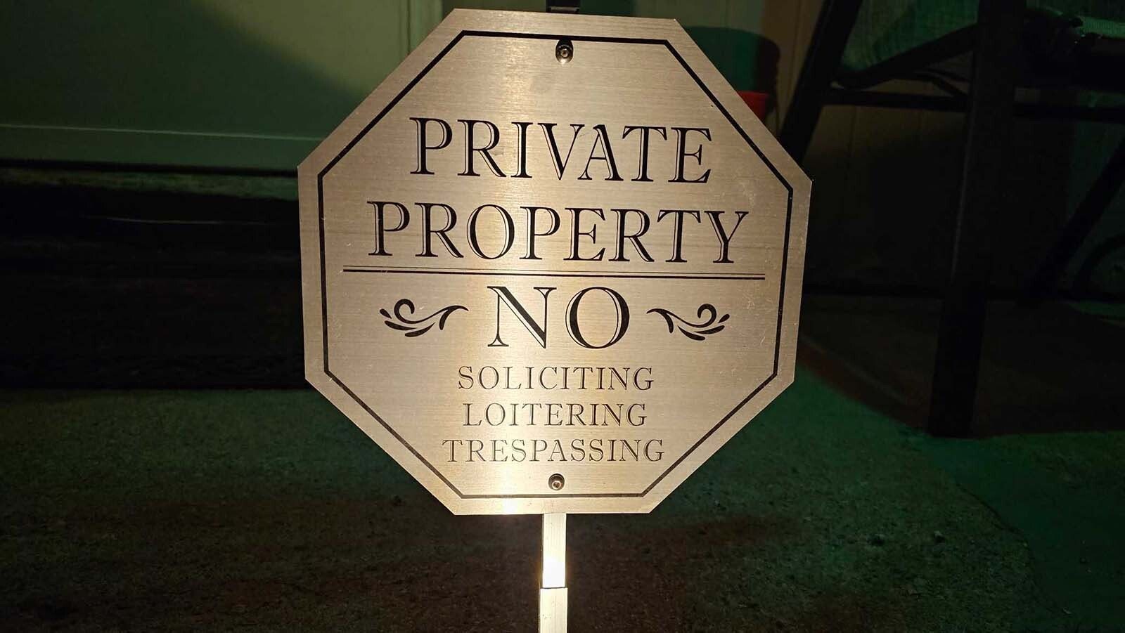 There are multiple signs displayed at this home to fend off solicitors. Even so, they still sometimes come knocking.