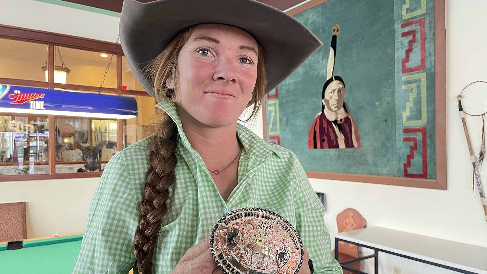 Tup Forge can’t believe she got the gold buckle at the Cheyenne Frontier Days Rodeo.