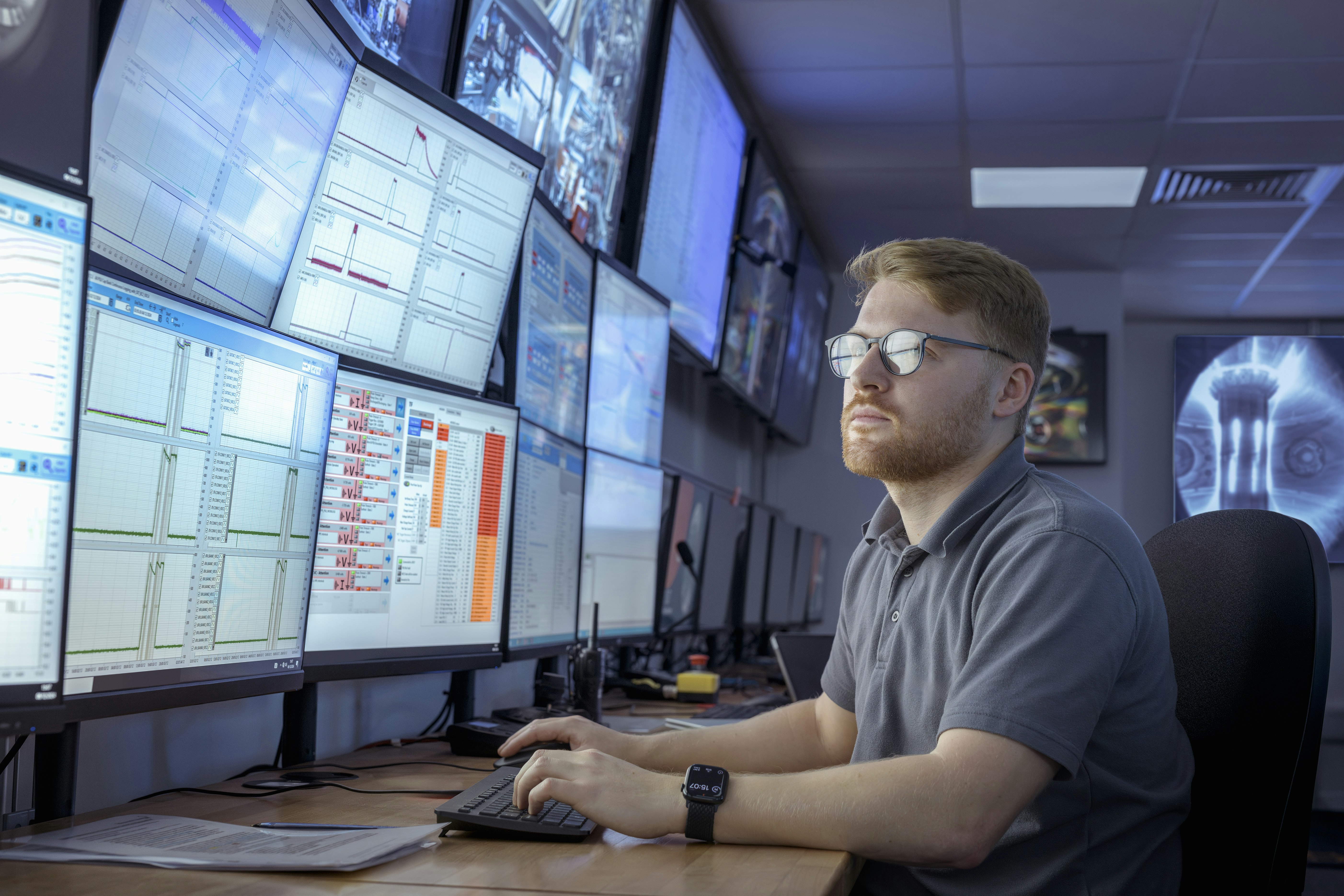 A scientist inspects date on screens in a control room of a nuclear reactor in this file photo.