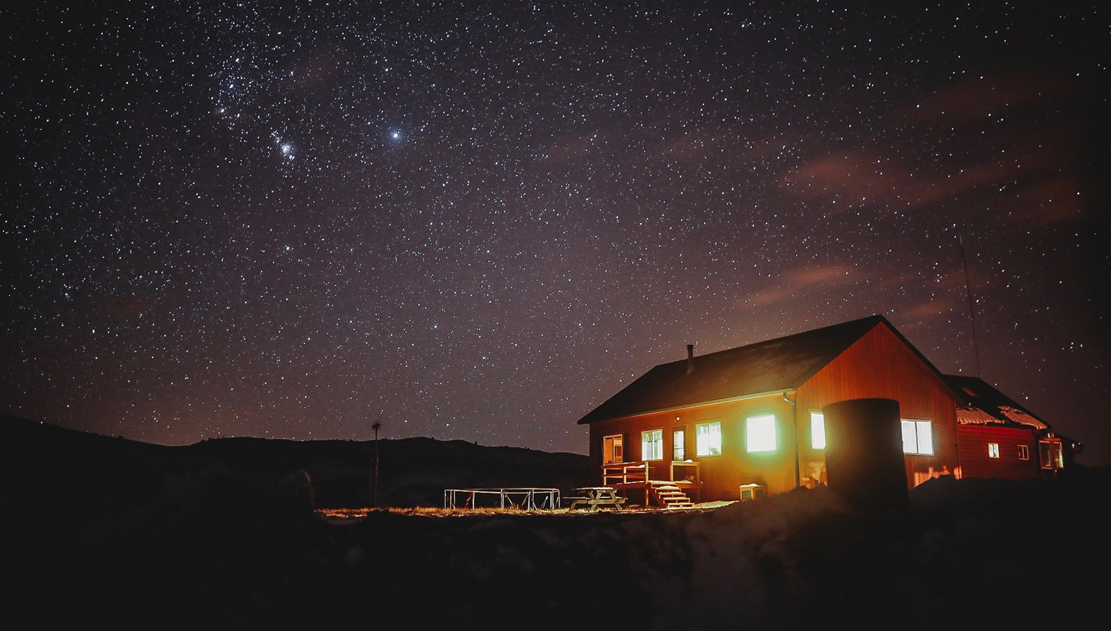 Josh Winkler’s off-grid cabin in remote Lincoln County on a clear winter night.