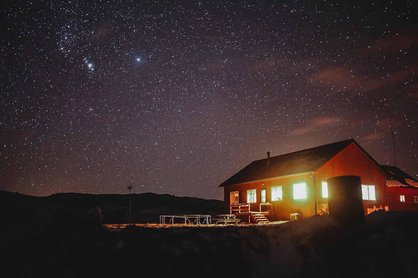 Josh Winkler’s off-grid cabin in remote Lincoln County on a clear winter night.
