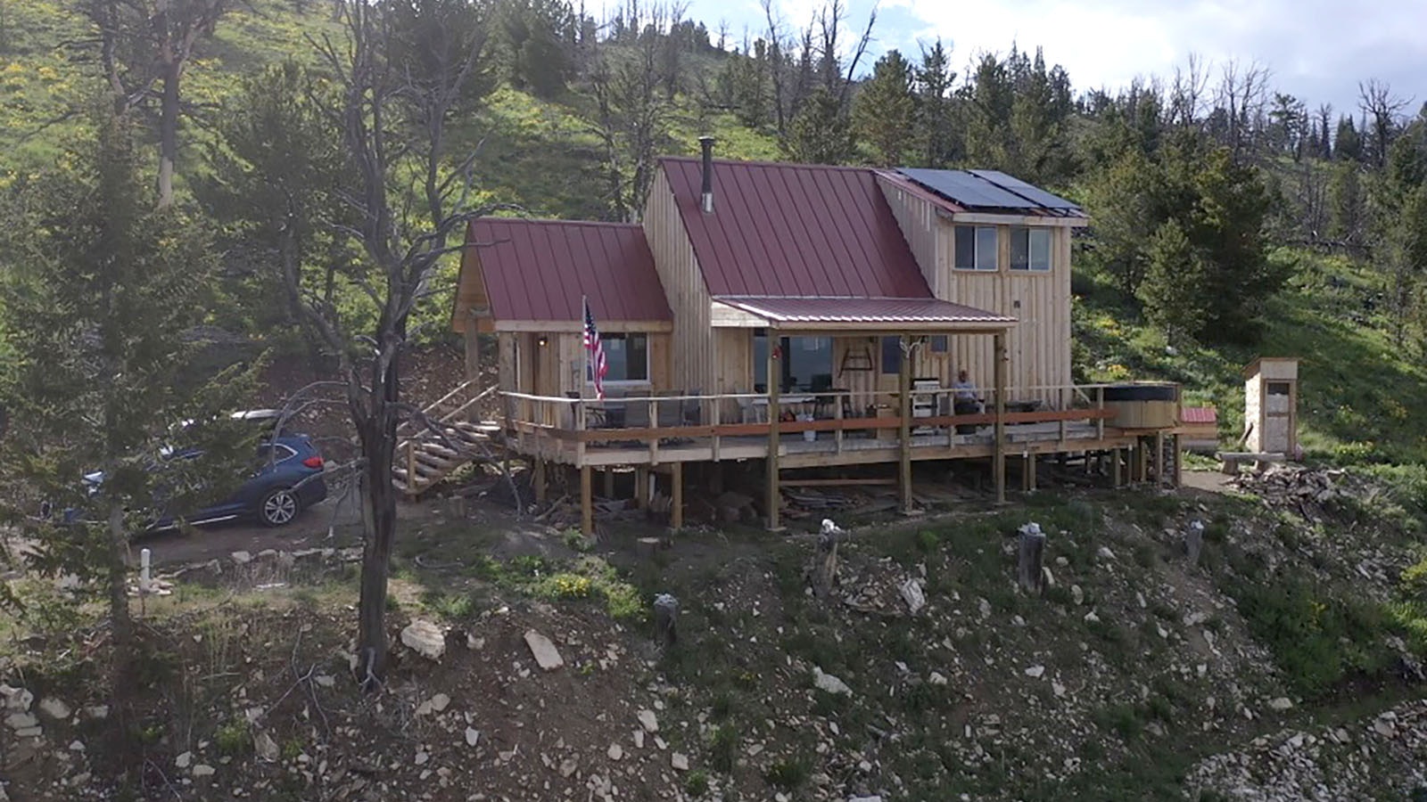 Cody Letteire’s off-grid mountain cabin at 9,000 feet has a bank of solar panels on the roof.