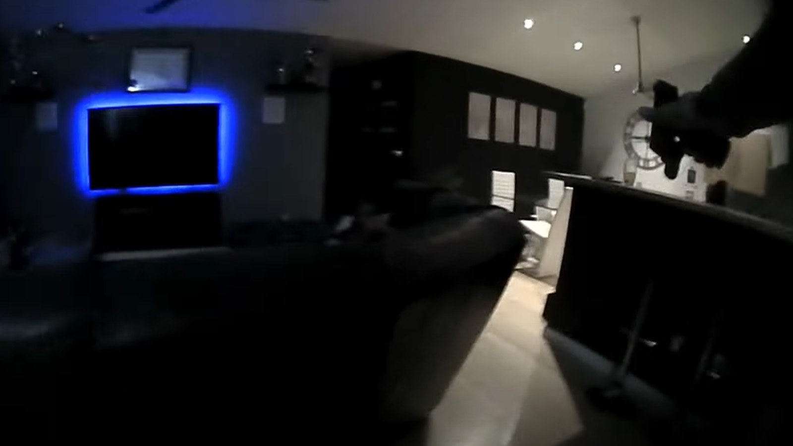 Body cam video released by the Laramie County Sheriff's Office shows an officer with weapon draw, upper right, entering a house after a suspect.