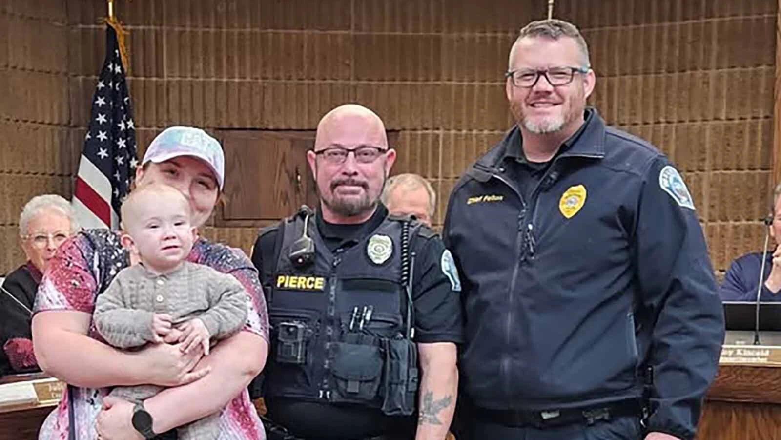 Glenrock Police Officer Shane Pierce, center, is honored by Colton Trullinger, his mom Autumn Trullinger, and Glenrock Police Chief Colter Fenton.