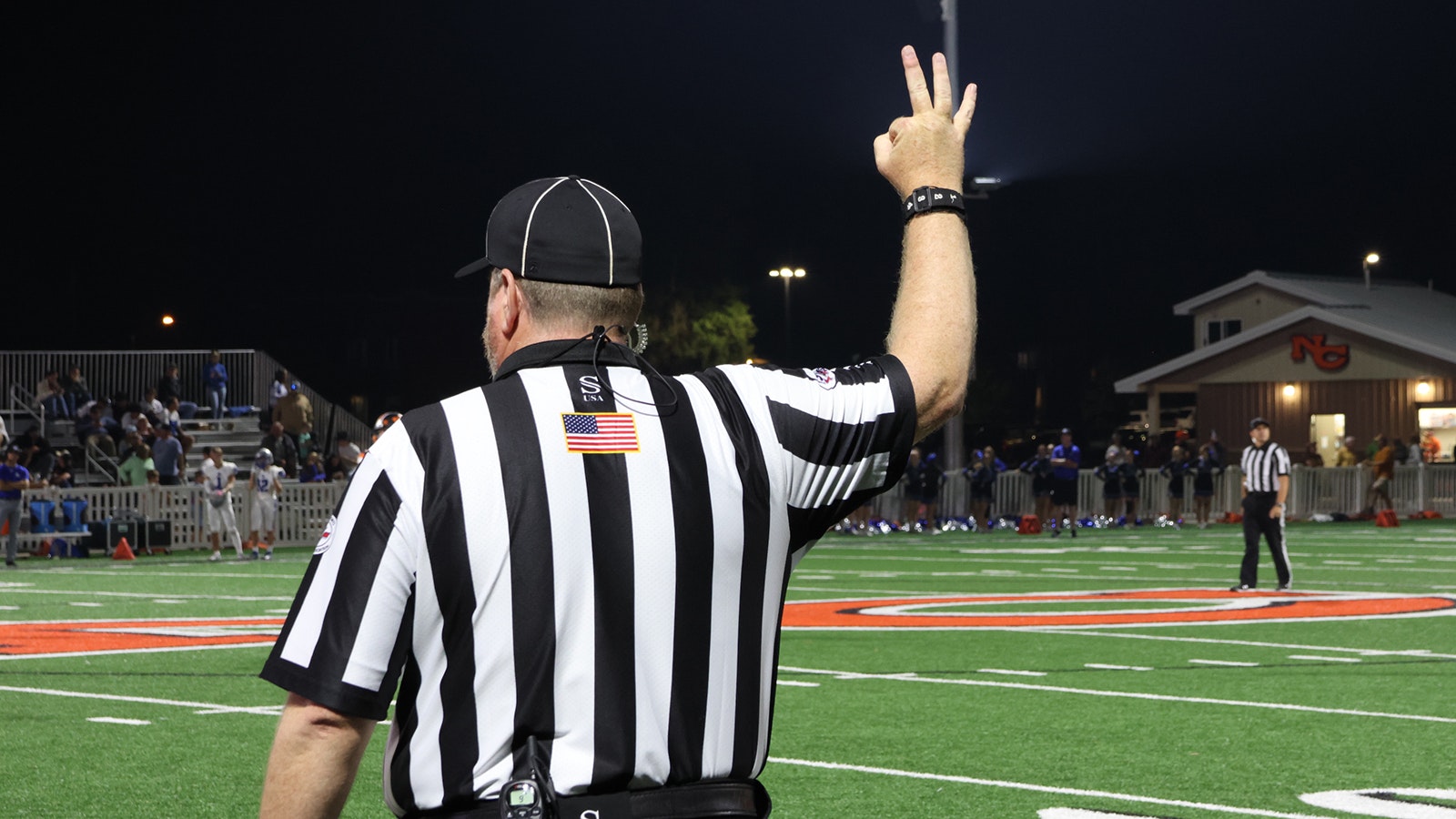 David Willems signals third down during the second half of the game.