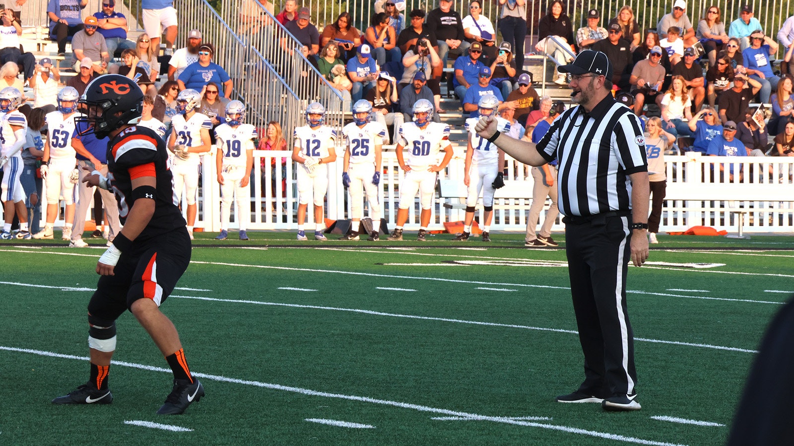 Umpire Warren Crawford signals during a play in the Casper game.