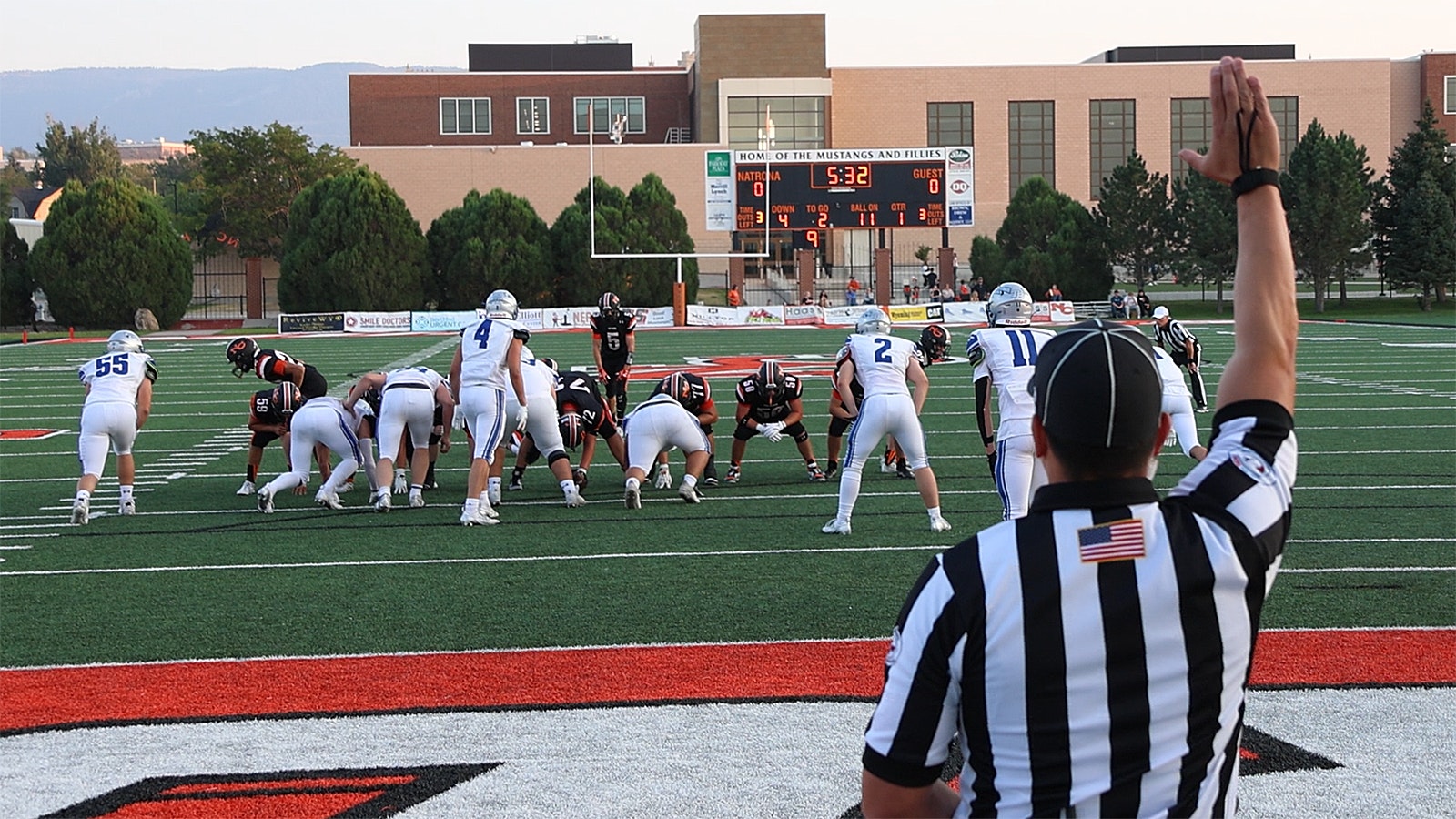 Back judge Cameron Jaure is ready to make the call on an extra point try.