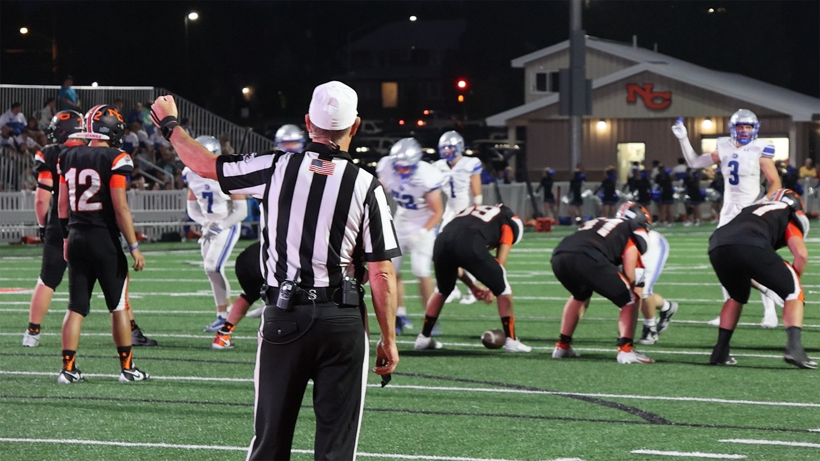 Referee Todd Pearson is ready for a play to start during Friday's varsity football game at Natrona County High School Stadium on Aug. 30, 2024.