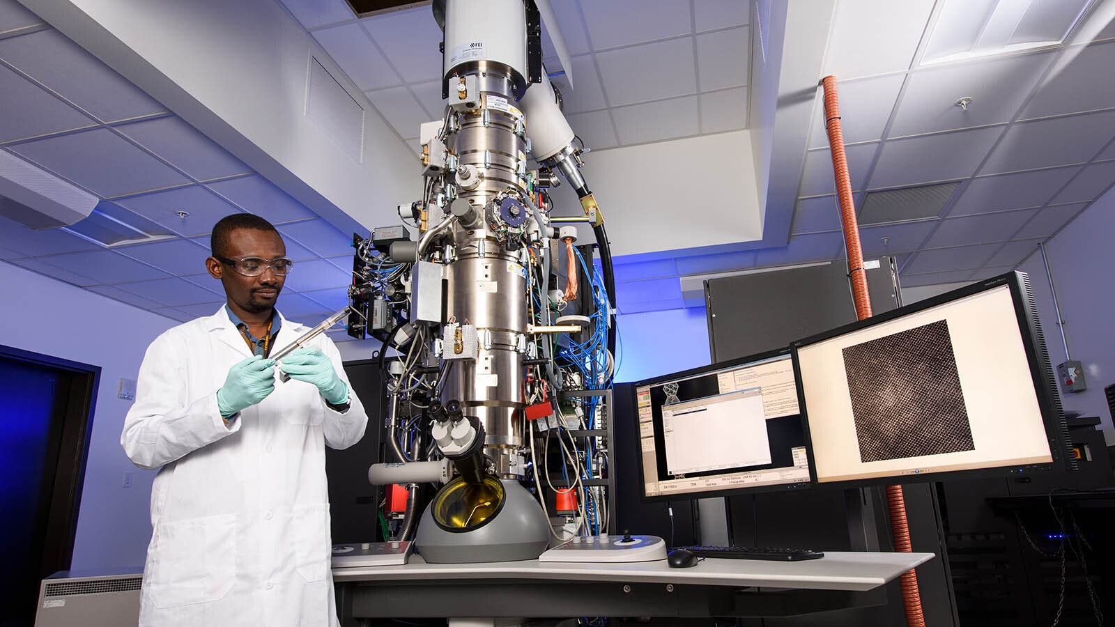 A researcher at the Center of Innovation for Flow Through Porous Media working at the University of Wyoming's High Bay Research Facility.