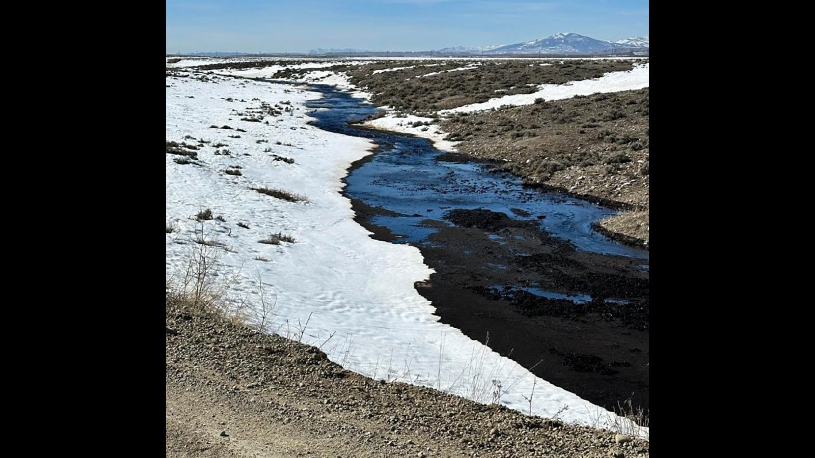 An undetermined amount of oil spilled into a tributary of the Wind River on the Wind River Indian Reservation on Monday.
