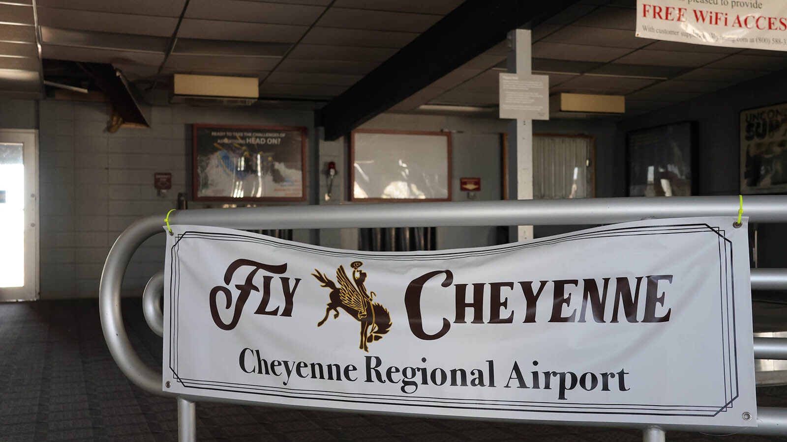An old banner advertising the airport can be found inside the old air terminal.