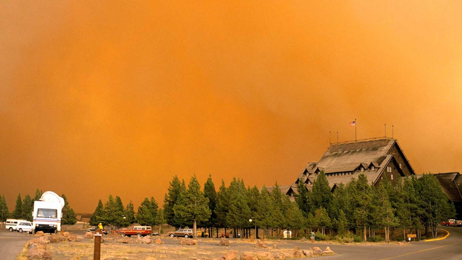 Wildfire rages near Old Faithful Inn during the infamous 1988 Yellowstone National Park wildfires.