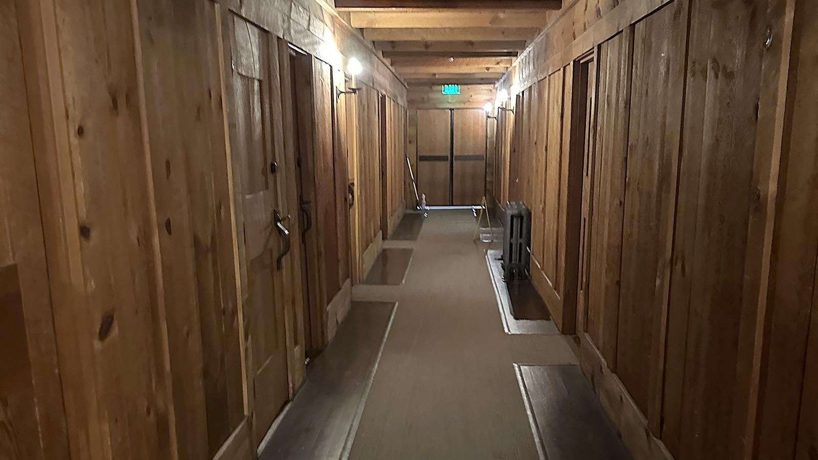 The hallway leading to Room 127 at Old Faithful Inn in Yellowstone National Park. After he murdered his wife, an angry new groom stomped down this hallway and disappeared from history.