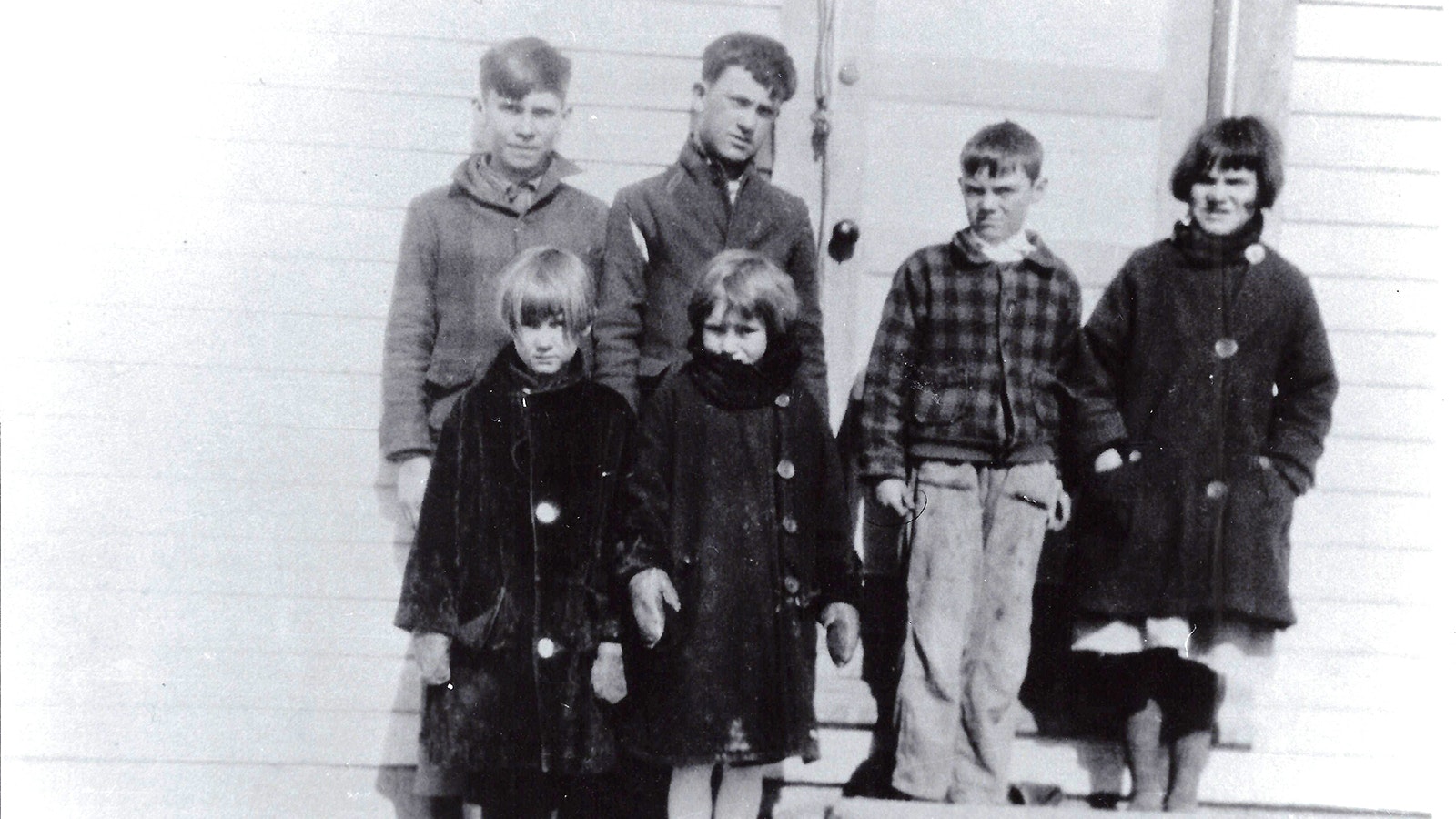 Students taught by Elise Mayor stand in front of the Big Four School in Four Mile near Kaycee in the late 1920s.