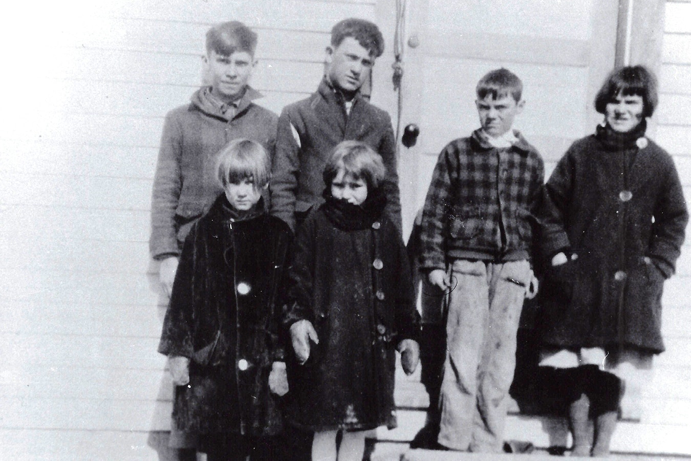 Students taught by Elise Mayor stand in front of the Big Four School in Four Mile near Kaycee in the late 1920s.