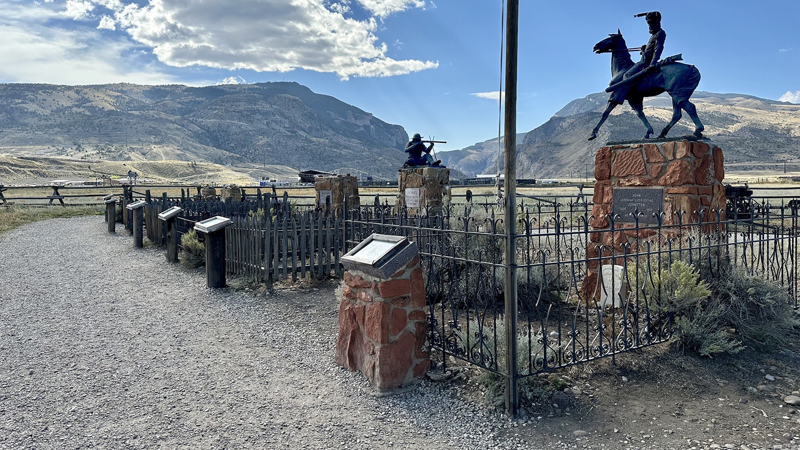 A line of graves at Old Trail Town. Seven people have been moved from where they were originally buried and reinterred at Old Trail Town because of their historical connections to the buildings on site or the American West overall.