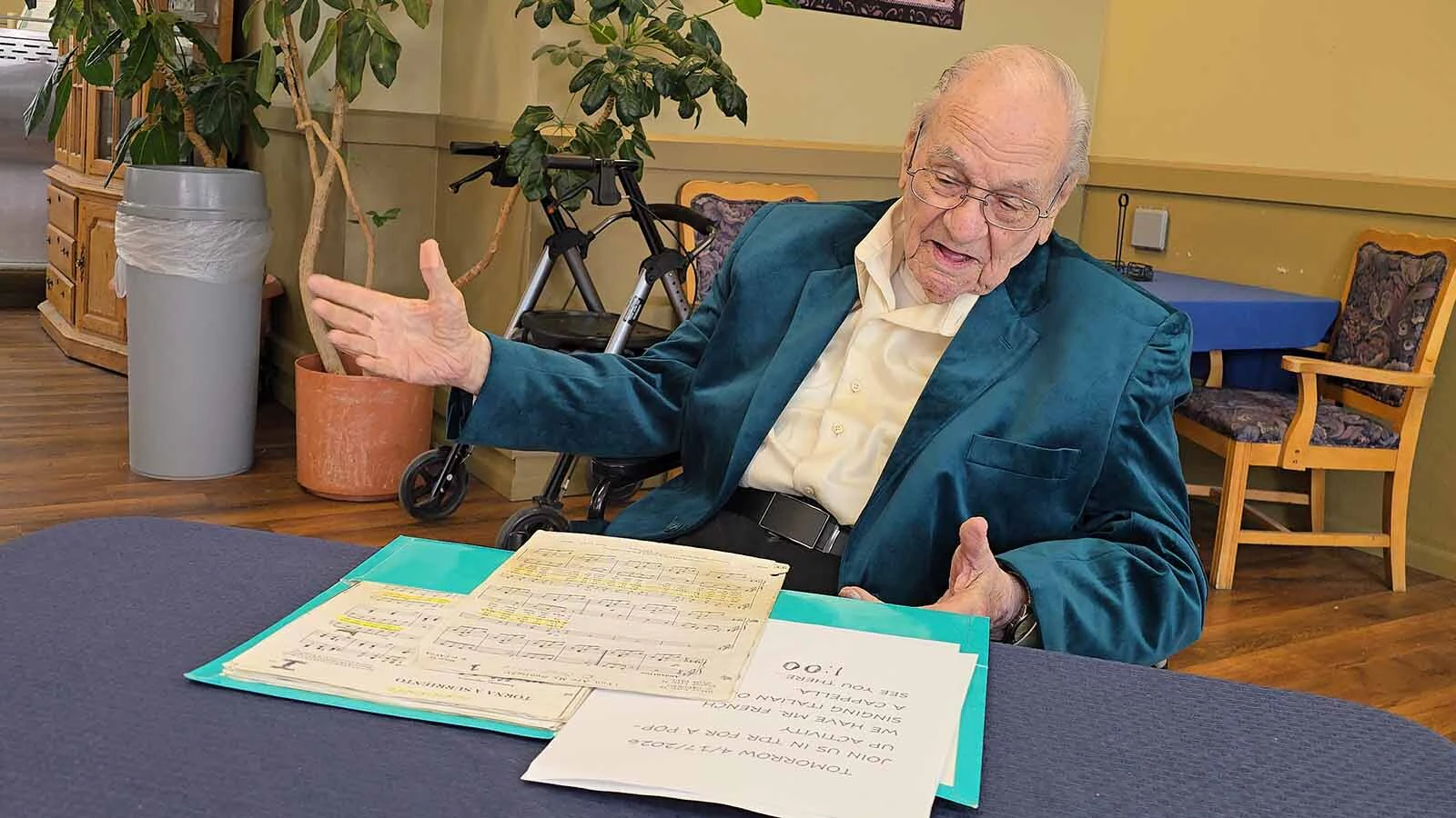 Rick French dressed for an opera-singing occasion in a velvet green jacket with a cream-colored shirt and crisply ironed black pants. Singing opera takes both skill and the right mindset.