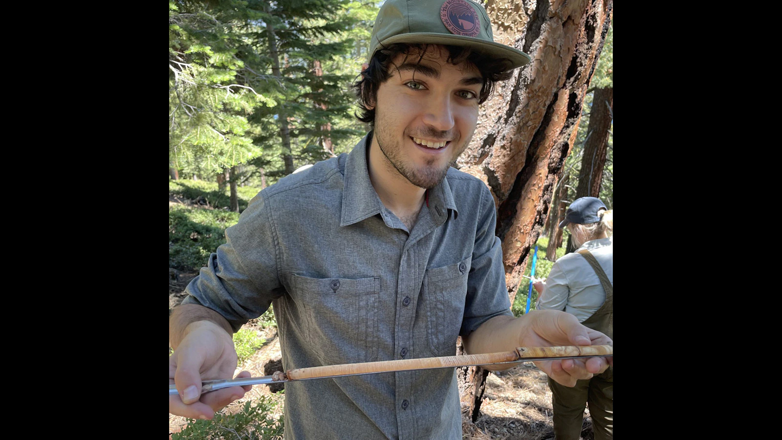 Jared Friedman, a Ph.D. student with the University of Wyoming's Botany Department, with a core taken from the oldest whitebark pine in the world. The tree rings on this core helped Friedman determine the tree was 1,289 years old when it died.