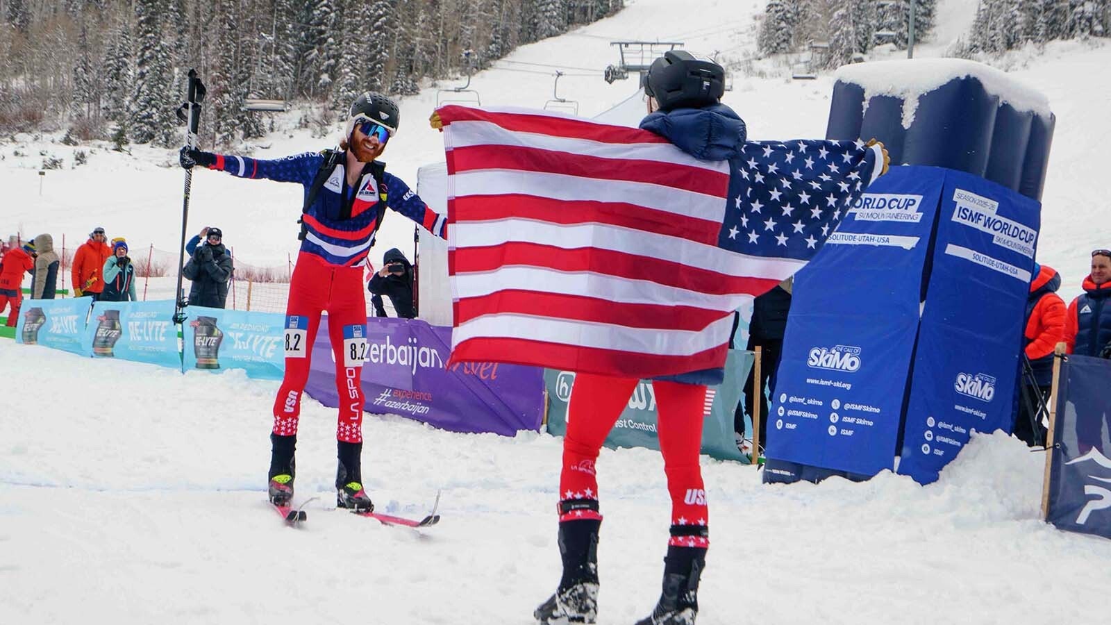 Anna Gibson greets teammate Cam Smith at the finish line. Their win qualified them for the 2026 Winter Olympics in Italy.