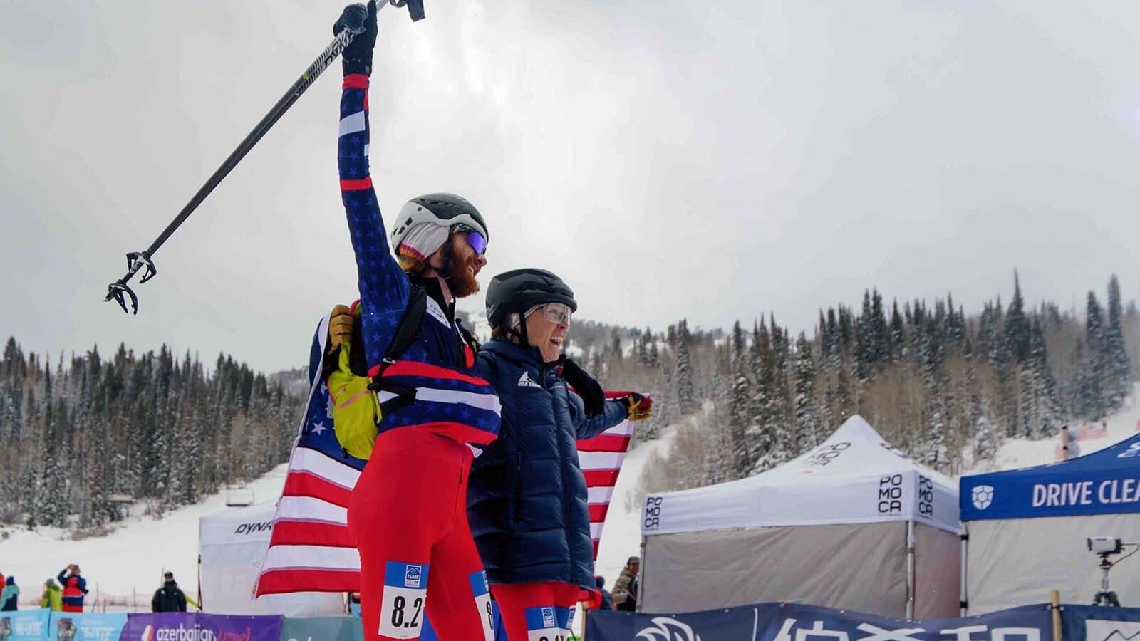 Anna Gibson greets teammate Cam Smith at the finish line. Their win qualified them for the 2026 Winter Olympics in Italy.
