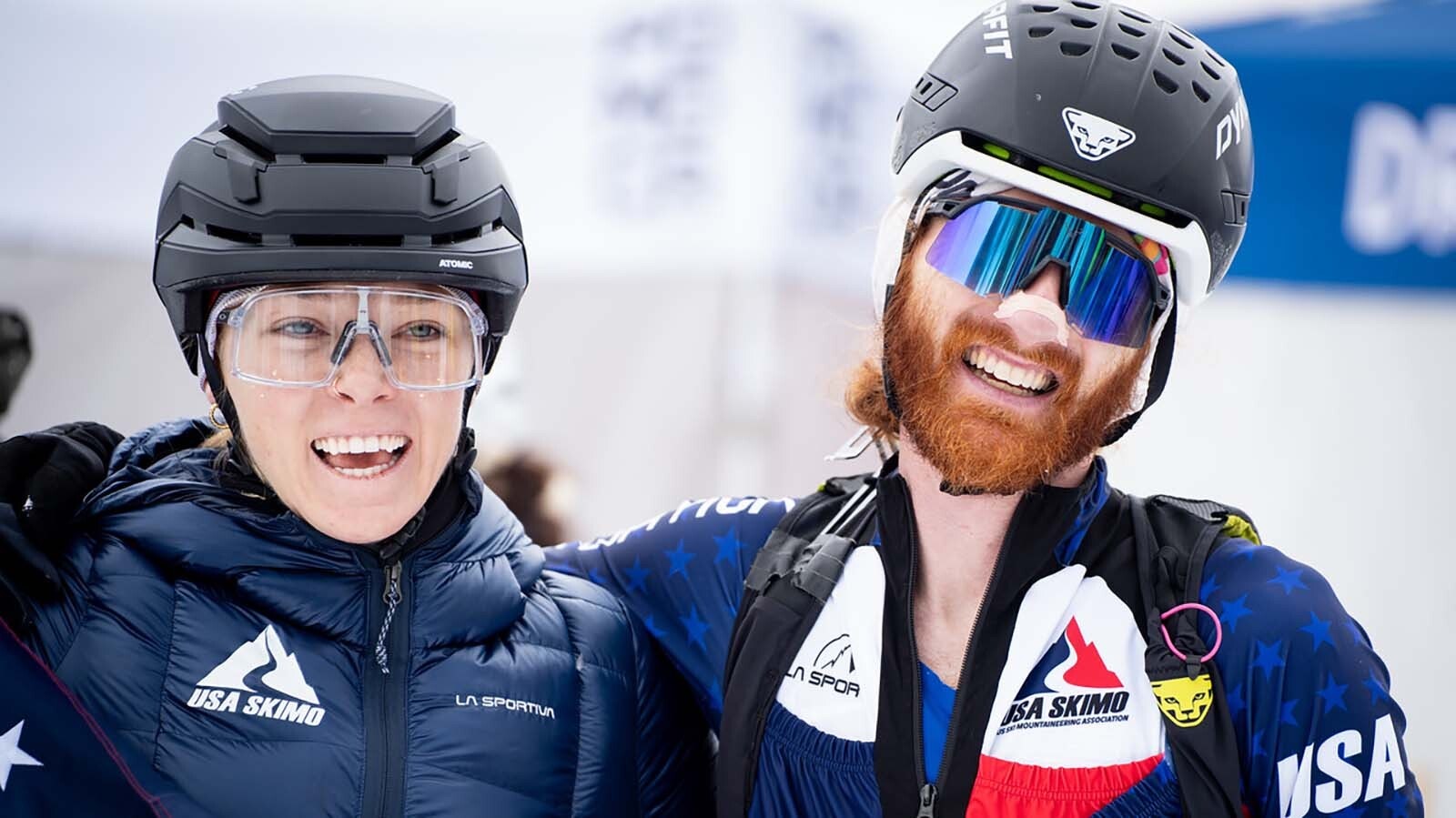 Anna Gibson greets teammate Cam Smith at the finish line. Their win qualified them for the 2026 Winter Olympics in Italy.