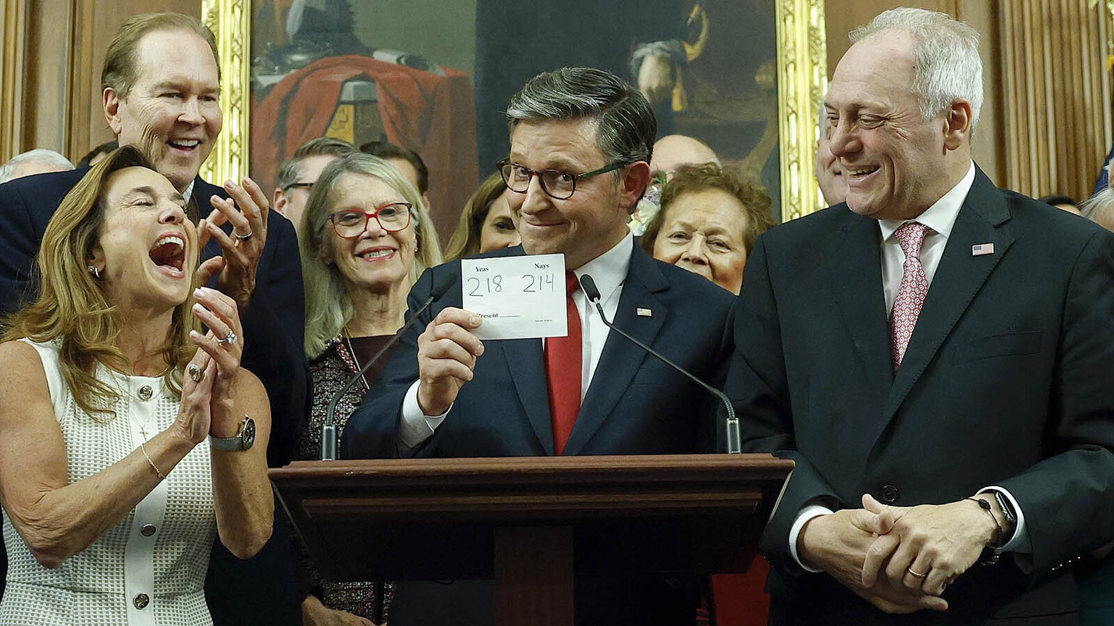 U.S. House Speaker Mike Johnson holds up a card showing the final vote tally to pass the massive budget bill known as the One Big Beautiful Bill on Thursday, July 3, 2024.