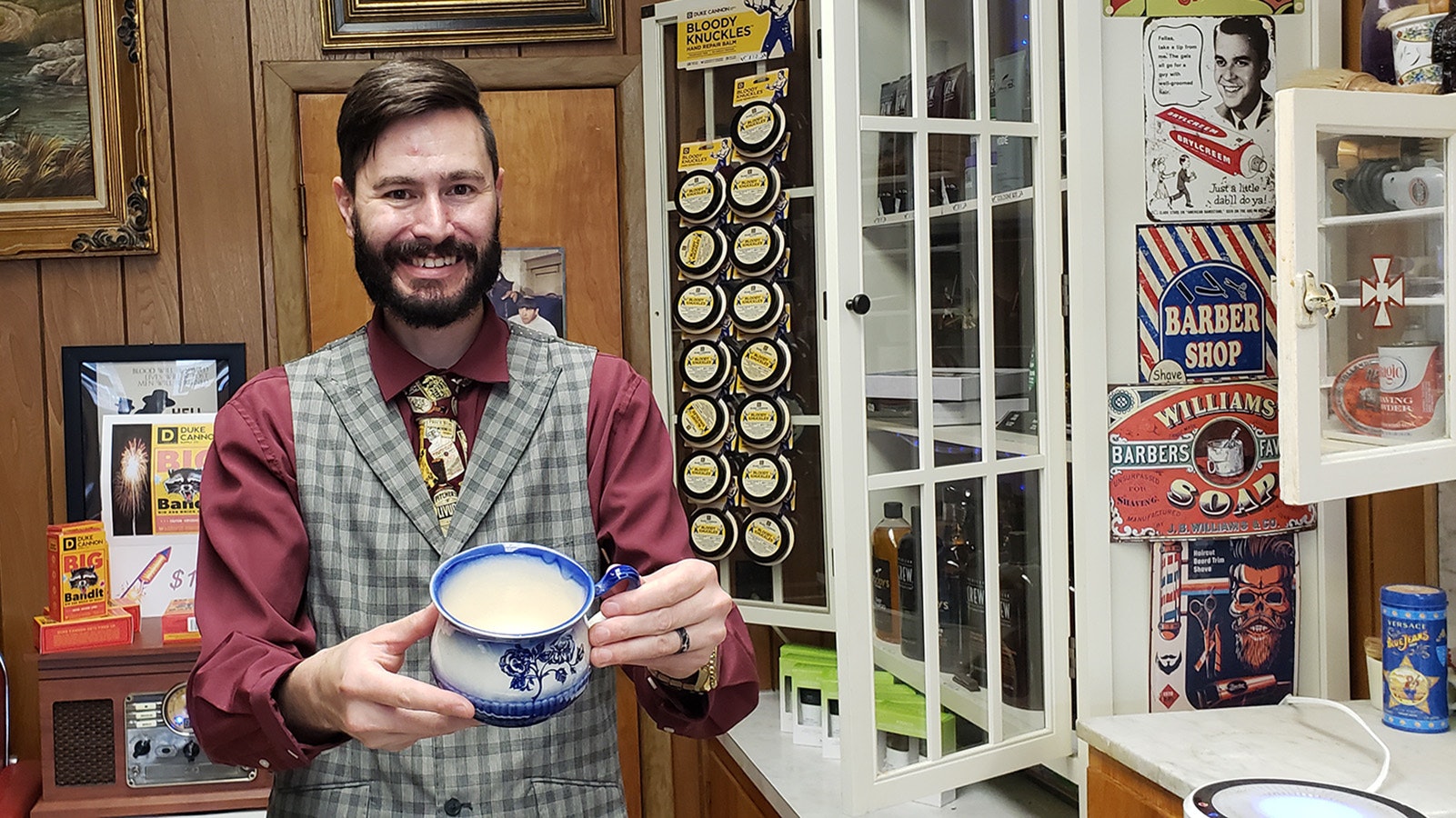 Kurt Matthew Wheeler shows a rare shaving cup in his shop.