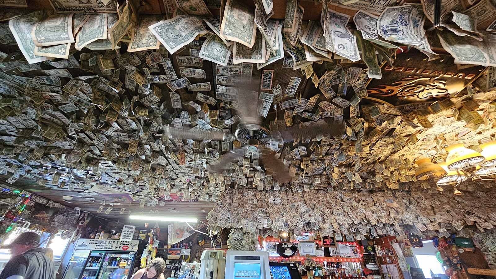 Dollar bills hang from the ceiling at The Buckhorn Bar in Buckhorn, Wyoming. The tradition began in the 1970s.