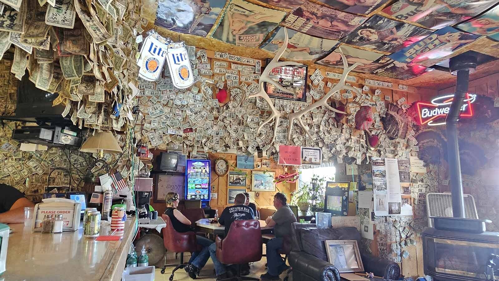 Patrons enjoy a beer at The Buckhorn Bar in Buckhorn, Wyoming, a few miles from the South Dakota Border. The bar is the last stop for a while as people head to Deadwood on Highway 85.