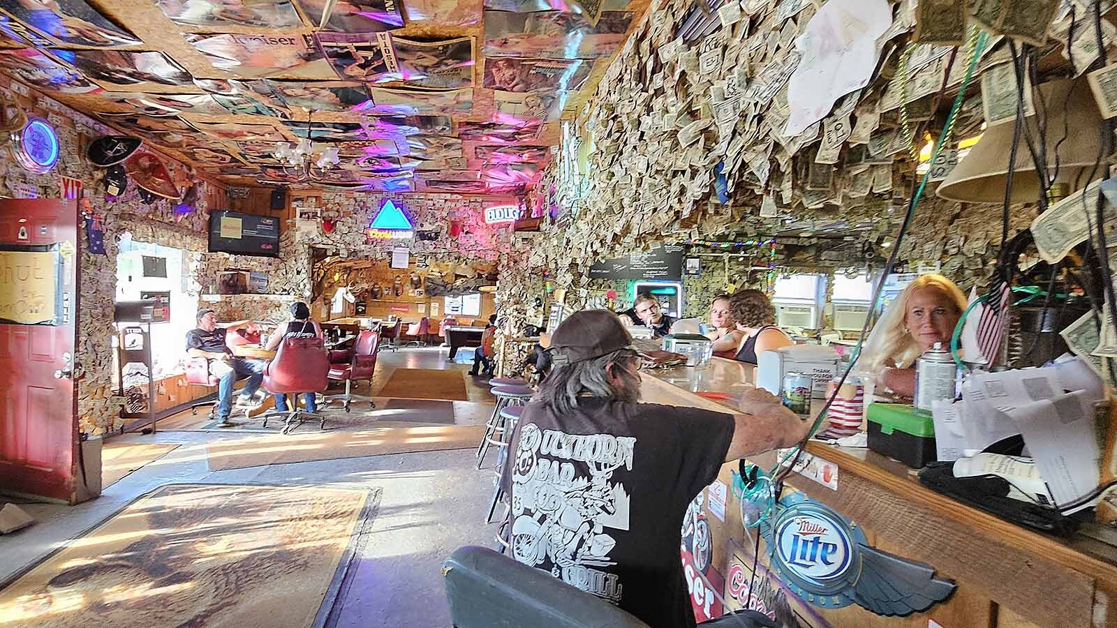 Owner Dale Steitz talks with friends at one of the bars at The Buckhorn Bar near South Dakota's border in Buckhorn, Wyoming.