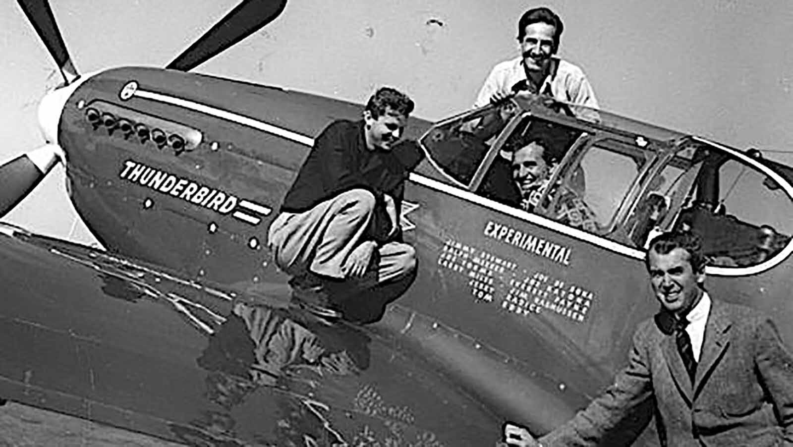 Jimmy Stewart and members of his racing team with the P-51.