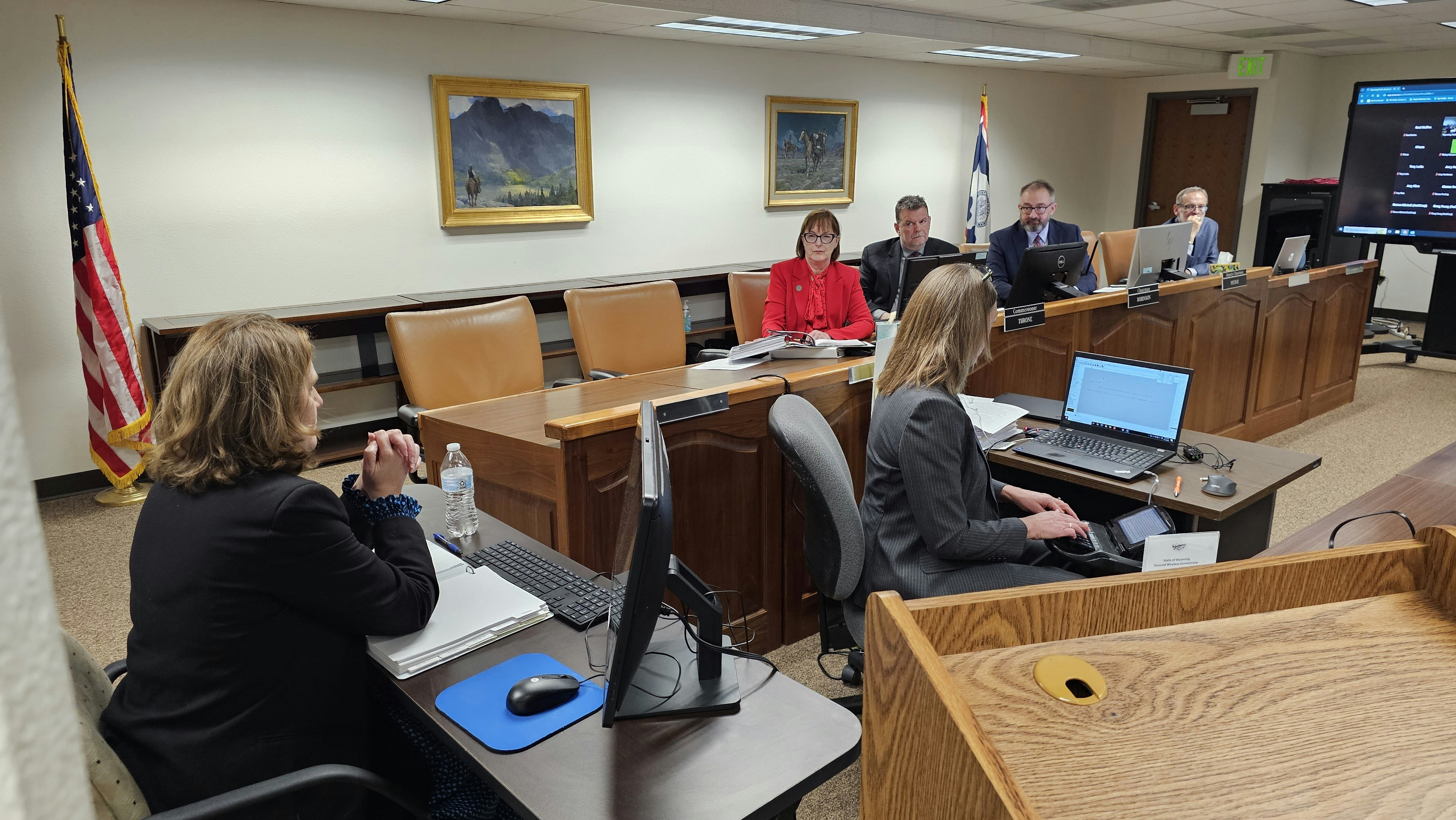 Commissioners listen intently as an employee of Rocky Mountain Power testified during a three-day hearing for the utility company's latest, double-digit rate increase request.