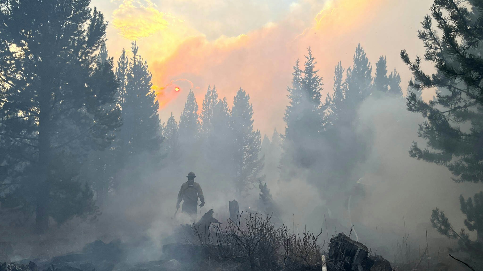 Despite the wet and snowy weather, fire crews continue working the Pack Trail Fire in northwest wyoming.