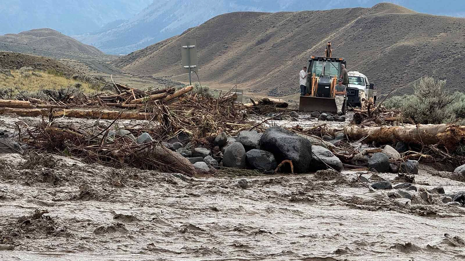 Park County officials say a Wednesday flash flood nearly destroyed a bridge over the Shoshone River and cut off access for some county residents. “We watched a wall of debris build up and surging muddy water begin to overflow the banks,” said a witness.