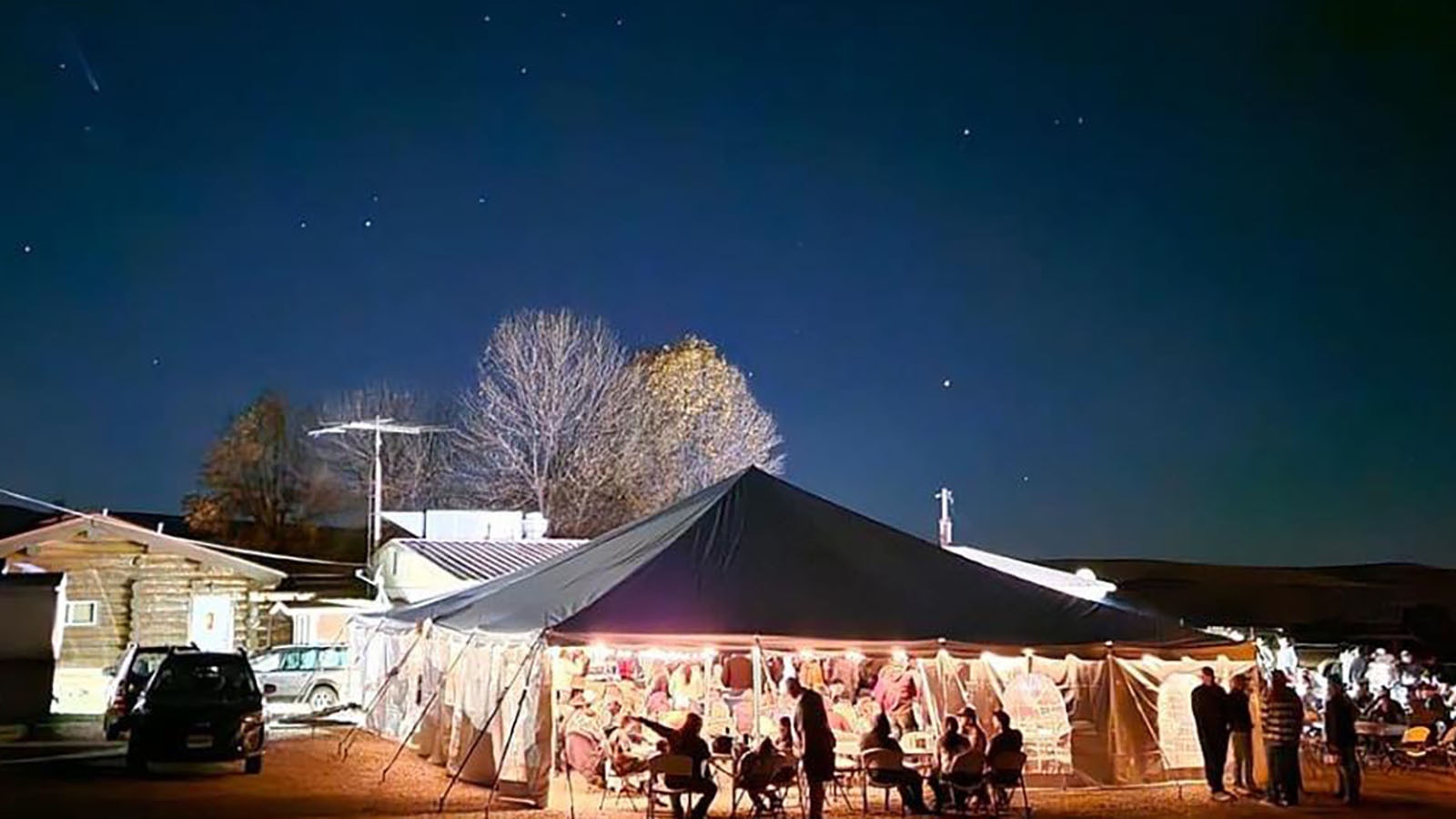 A comet is faintly visible in the upper left in this photo taken at the Parkman Bar and Grill during Saturday's Let it Rain concert.