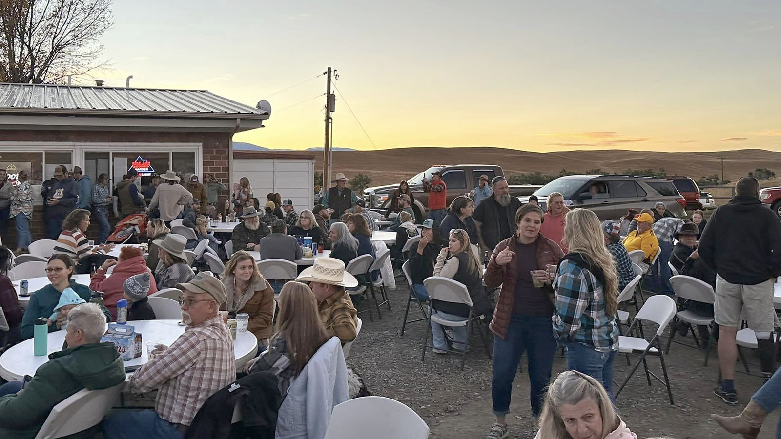 Extra tables had to be pulled from storage to expand the eating area at the Let it Rain Concert in Parkman, even as smoke from the nearby Elk Fire continues to linger in the air.