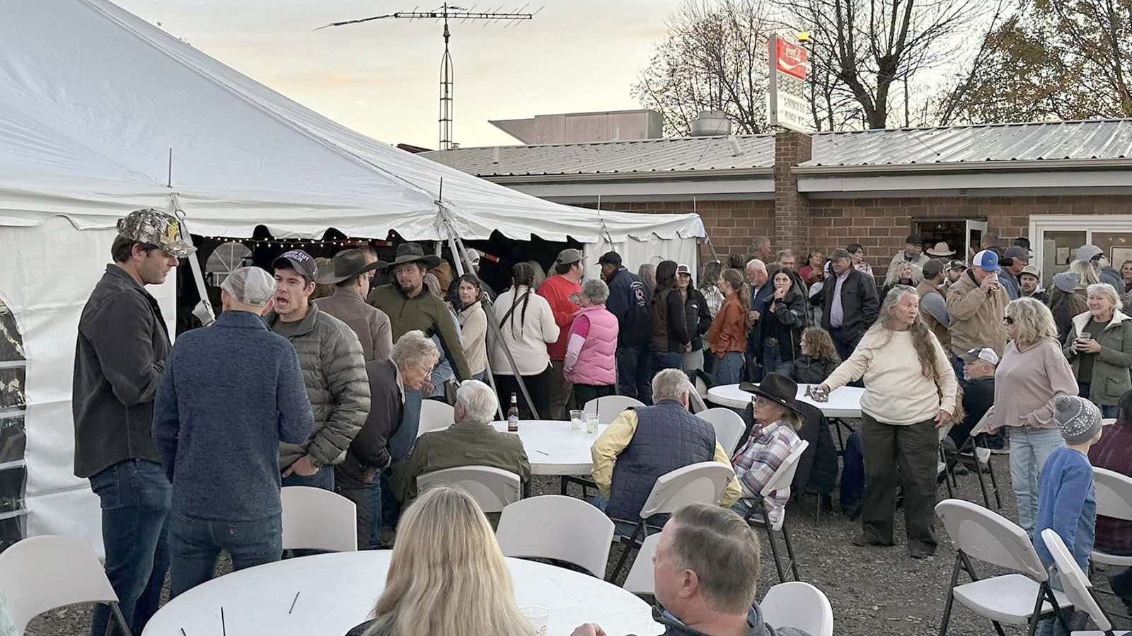 No room in the tent, no problem. People collected outside in the parking lot to thank firefighters and celebrate recent rain.