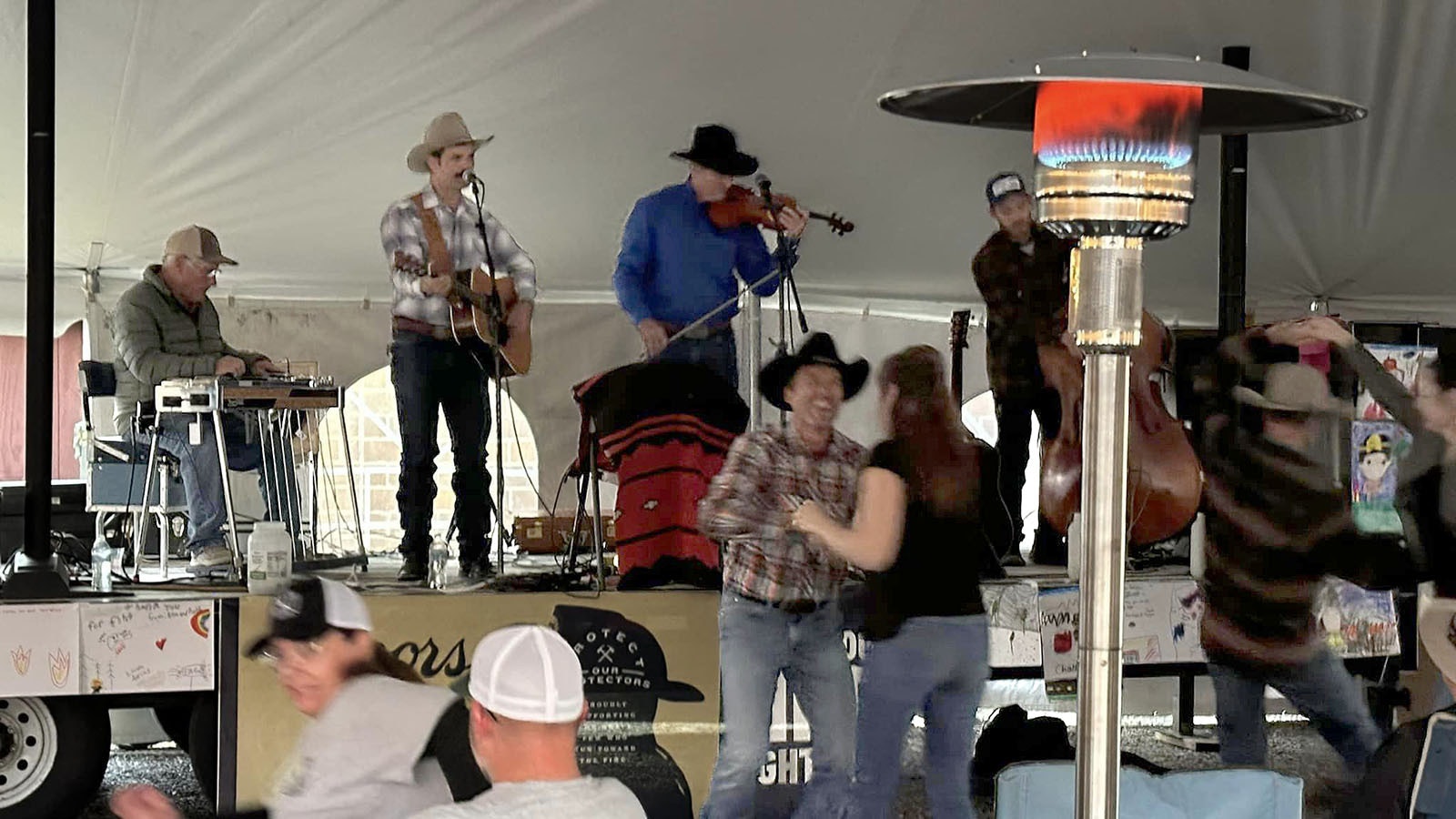 People were in motion at the Let it Rain Concert where Tris and David Munsick and their band played to celebrate and thank firefighters battling the Elk Fire.