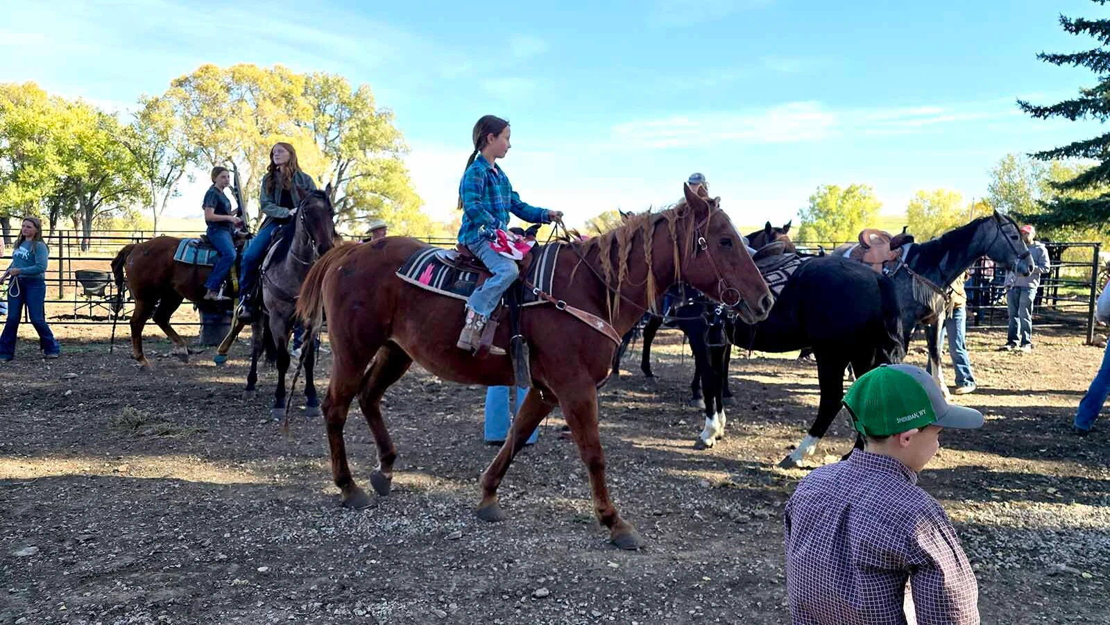 Kids milled about on their horses at the Double Rafter Ranch's neighborhood block party. It's not just a bring your own beverage event, it's a bring your own horse event too.