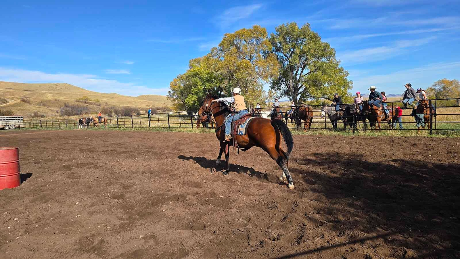 A rider makes a quick turn during the barrel races at the Double Rafter Ranch's neighborhood block party and rodeo. It was bring a dish, bring your own beverage,  and, if you have one, bring your own horse.