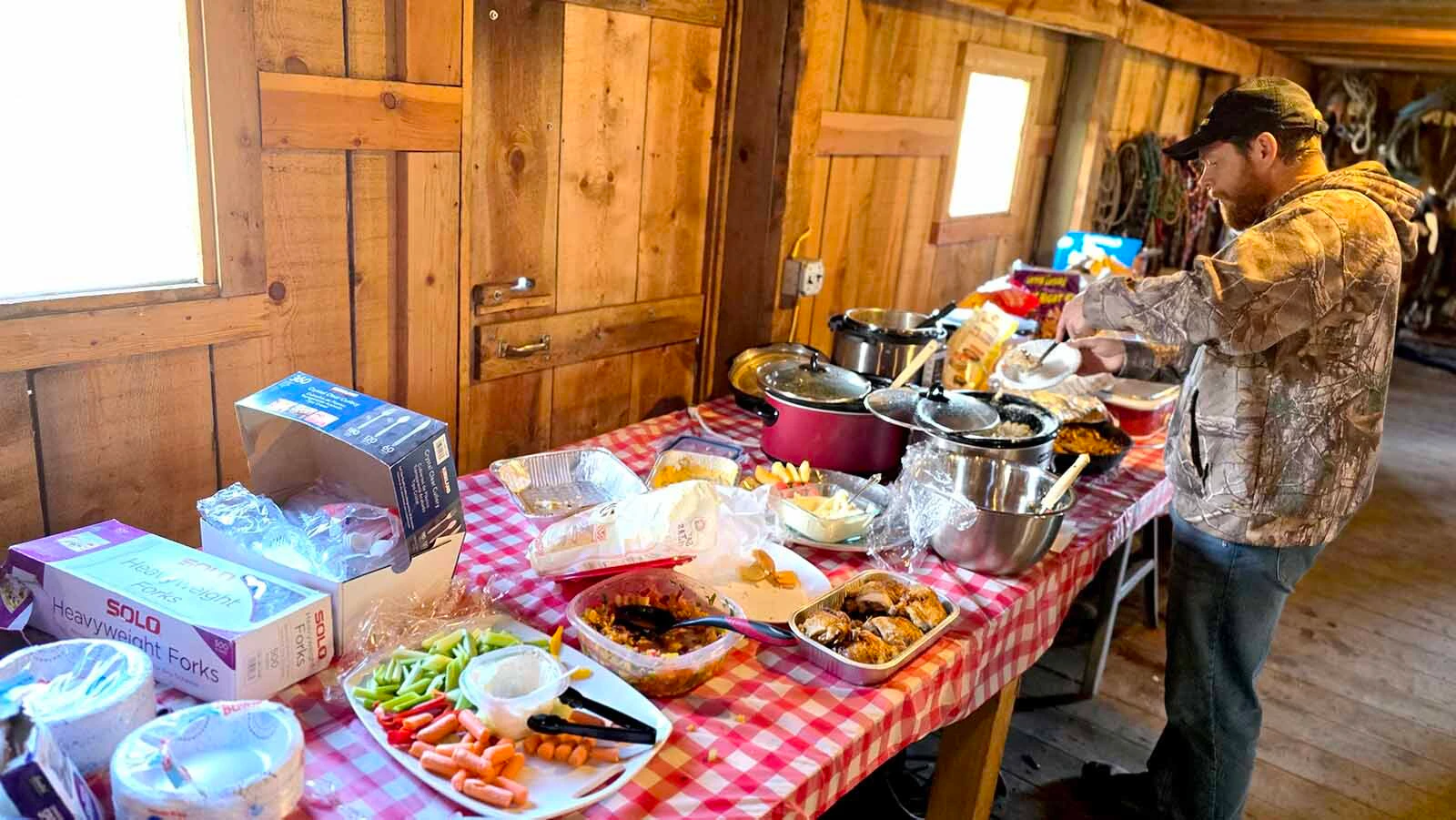A potluck was set up inside the Double Rafter Ranch's barn during its neighborhood block party and rodeo.