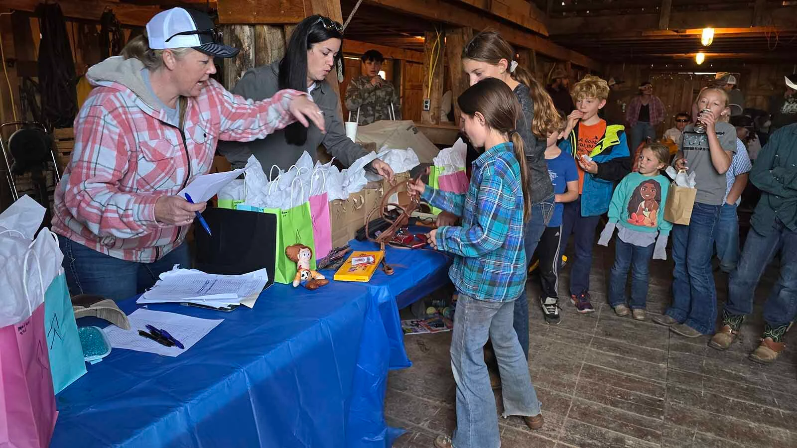 Children gathered for prizes at the end of the Double Rafter Ranch's neighborhood block party and rodeo.
