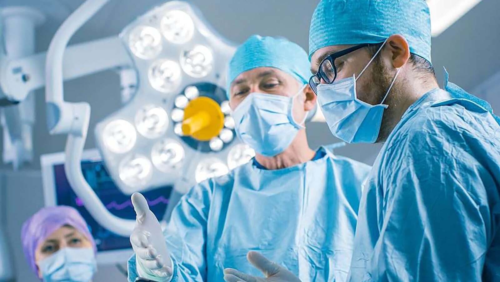 Fractional surgeons with Synergy Health Partners discuss a case.