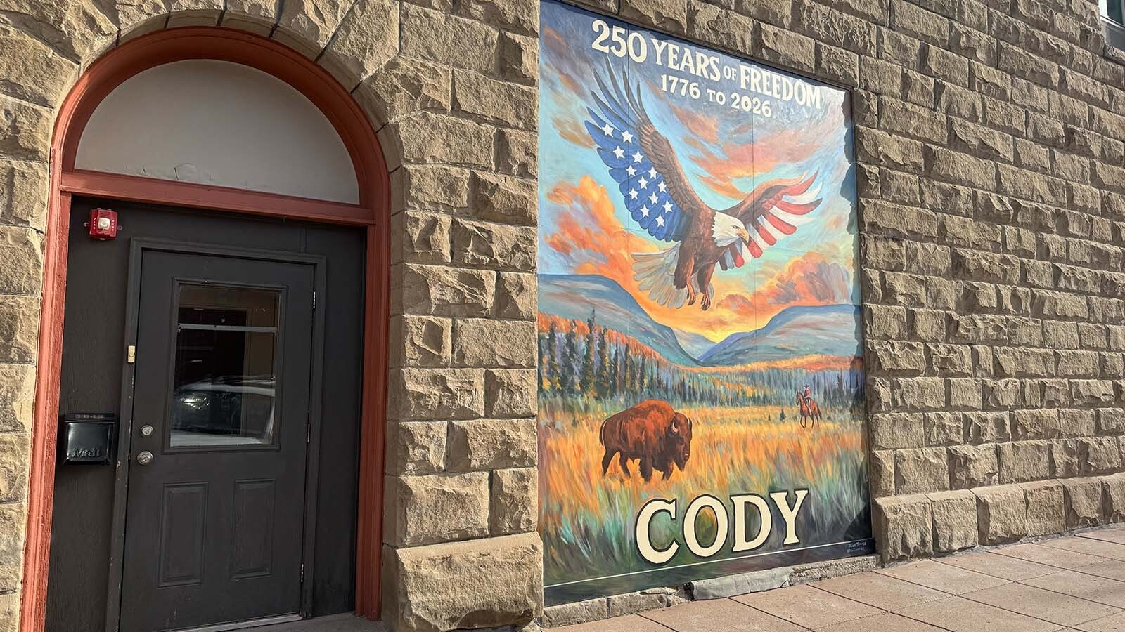 While the nation prepares for the 250th anniversary of America in 2026, Cody's doing a year of celebrating before and after the Fourth of July. A new mural depicting a starred and striped eagle over the city's mountains is the latest patriotic placement.