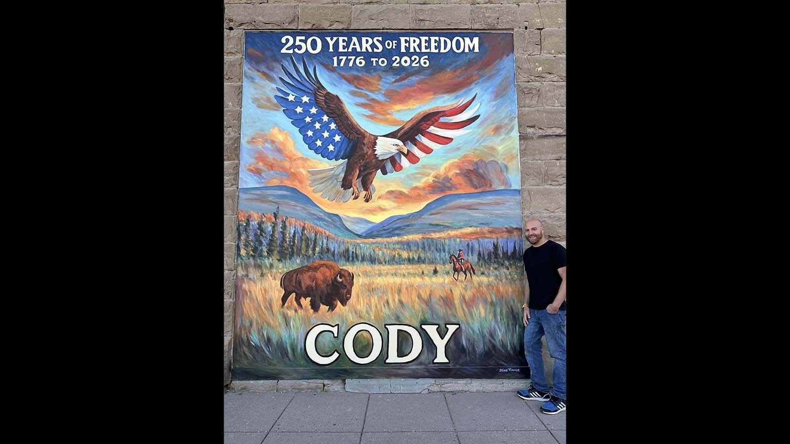 While the nation prepares for the 250th anniversary of America in 2026, Cody's doing a year of celebrating before and after the Fourth of July. A new mural depicting a starred and striped eagle over the city's mountains is the latest patriotic placement.